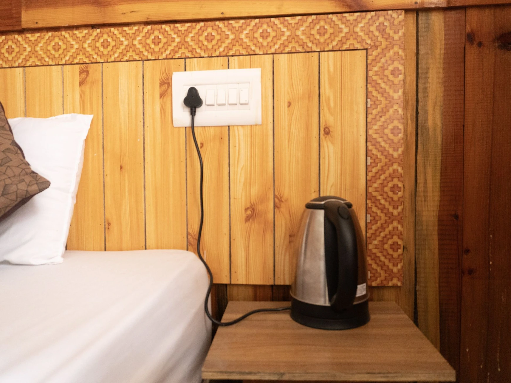 Cozy interior seating area at Tirthan Midpoint Homestay